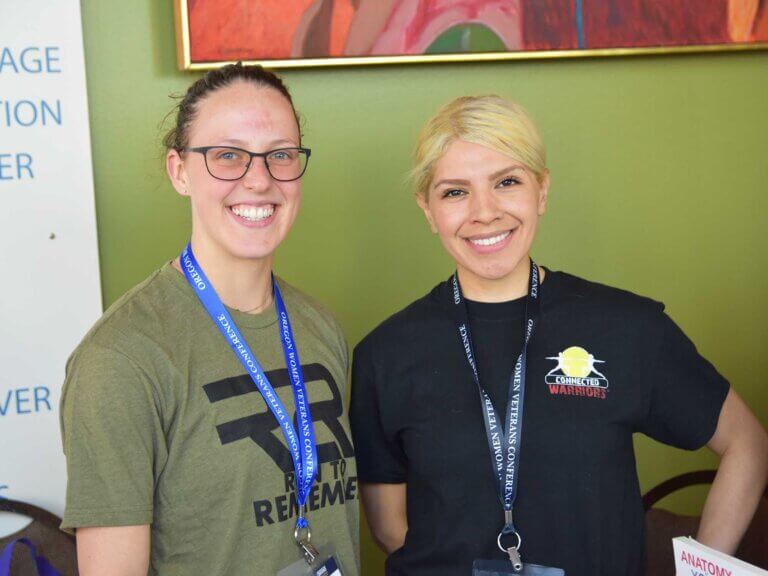 Two women vets pose for a photo