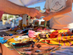 Selling crafts at a farmers' market.