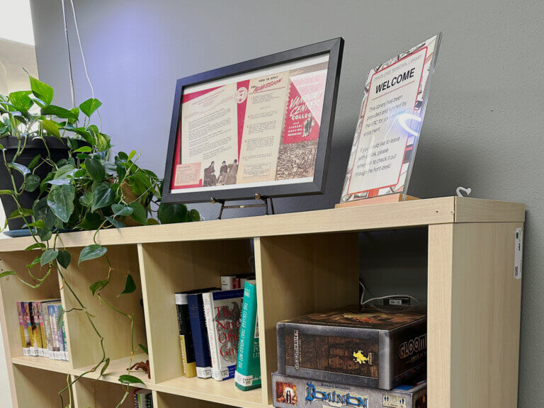 Shelving with books and games in a student veterans resource center